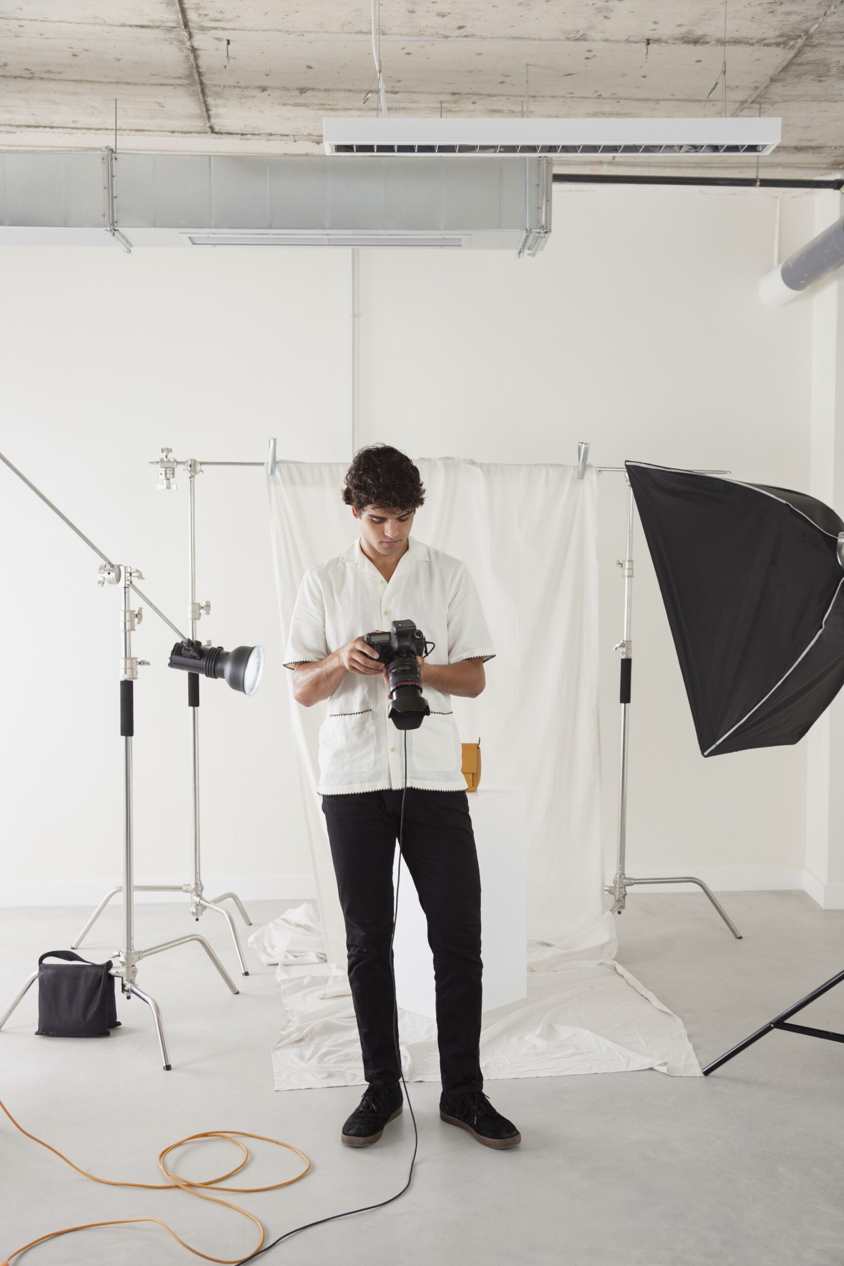 young-man-working-his-photography-studio